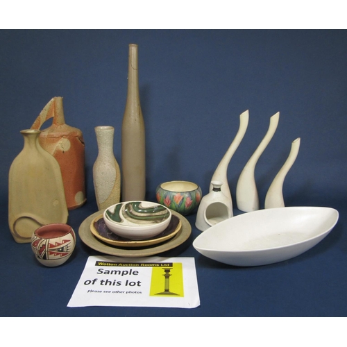 1005 - A collection of Studio pottery wares of various design and make including a set of three white glaze... 