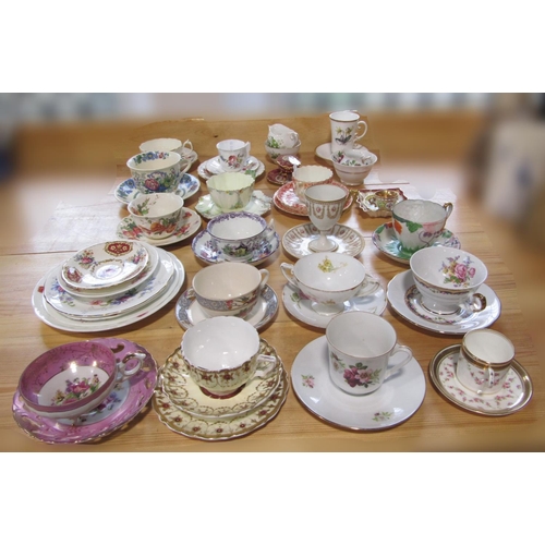 1006 - A collection of decorative cups and saucers, trios, etc including a Royal Worcester cabinet coffee c... 