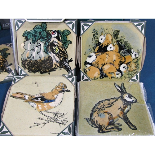 10 - A collection of 19 ceramic tiles by John and Fiona Cutting with decoration of birds, a hare, family ... 