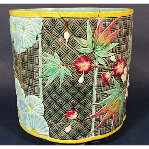 26 - A 19th century majolica jardinière with relief moulded and painted Japanese style floral and leaf de... 