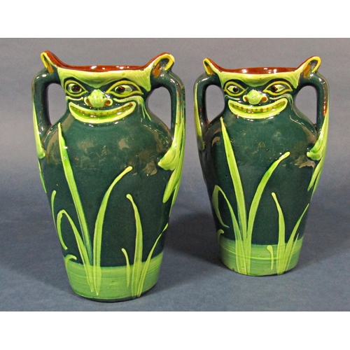 27 - A pair of early 20th century Allervale three handled vases with moulded and painted grotesque mask d... 