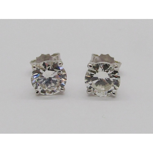 319 - Pair of 18ct white gold brilliant cut diamond stud earrings in four prong setting, total diamond wei... 