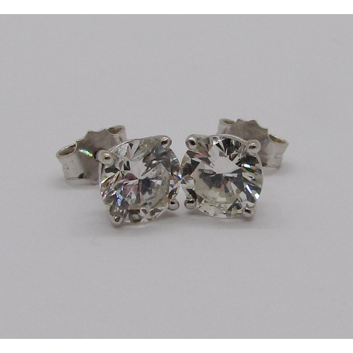 319 - Pair of 18ct white gold brilliant cut diamond stud earrings in four prong setting, total diamond wei... 