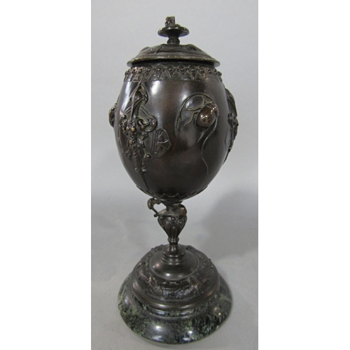 609 - A 19th century bronze urn with cover with stag beetles to the sides, raised on a marble base, signed... 