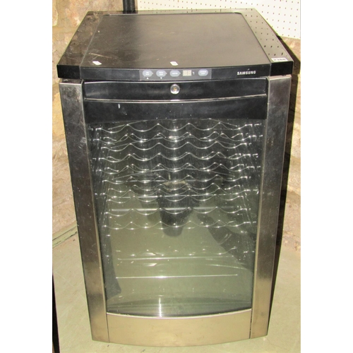 A Samsung wine fridge in black colourway to hold 30 bottles Barnebys