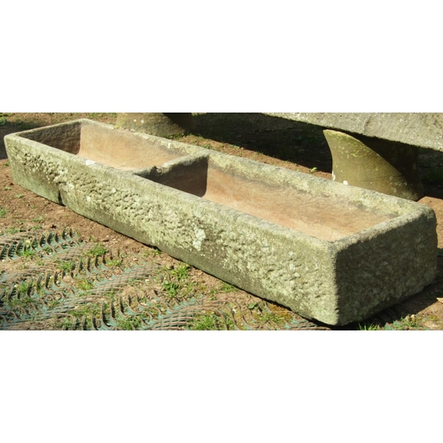 A good weathered natural stone two divisional feeding trough of rectangular form, 156 cm long x 31 cm wide x 18 cm high