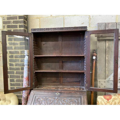 1018 - A Victorian carved oak bureau bookcase, width 94cm, depth 54cm, height 203cm