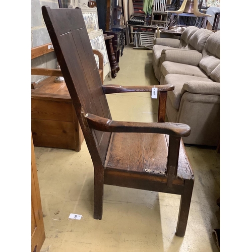 1032 - An early 18th century oak elbow chair, width 68cm, depth 63cm, height 112cm