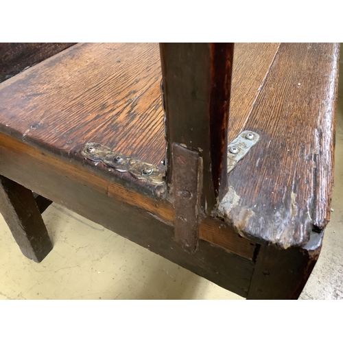 1032 - An early 18th century oak elbow chair, width 68cm, depth 63cm, height 112cm