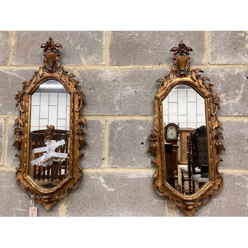 1033 - A pair of carved giltwood wall mirrors, width 30cm, height 74cm