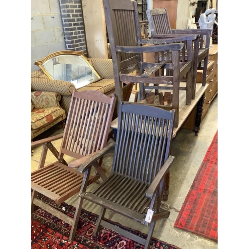1058 - Three various teak folding garden elbow chairs together with two other teak garden chairs... 