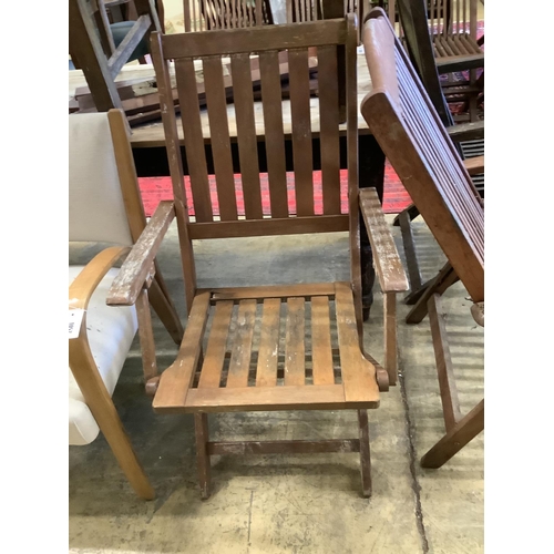 1058 - Three various teak folding garden elbow chairs together with two other teak garden chairs... 