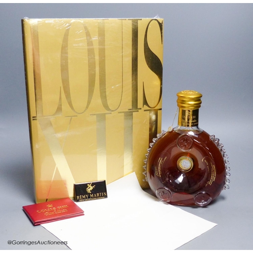 A sealed bottle of Louis XIII Remy Martin Grand Champagne Co... Barnebys