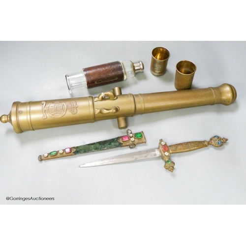 A bronze model cannon barrel, a dagger and a leather cased '... Barnebys