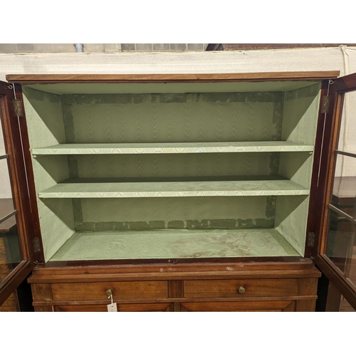 10 - A 19th century Continental mahogany glazed side cabinet, width 116cm, depth 40cm, height 166cm... 