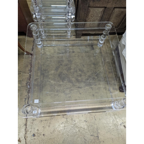 53 - A contemporary square perspex and glass two tier coffee table, length 120cm, depth 40cm