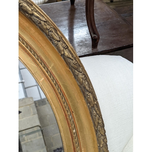 55 - A Victorian oval giltwood and gesso wall mirror, width 80cm, height 94cm