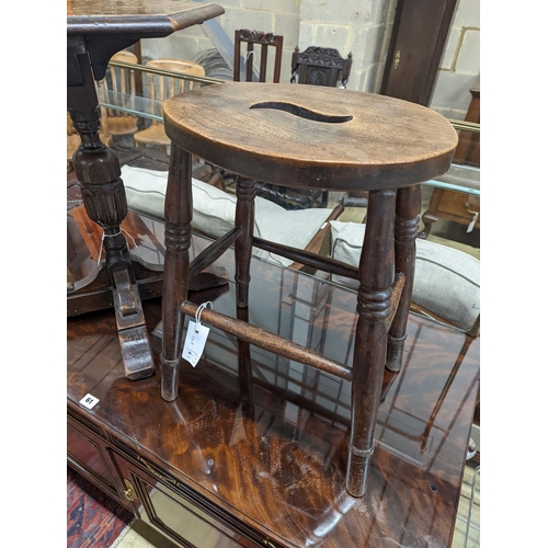 60 - A Victorian elm stool together with an 18th century style hexagonal oak occasional table, table heig... 