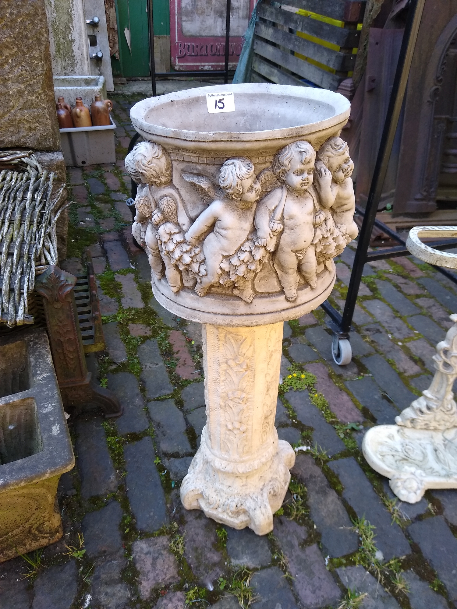 Concrete Garden Ornament decorated with cherubs