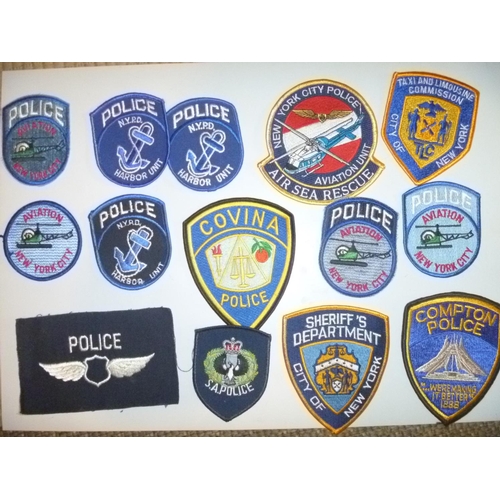 selection of USA cloth police patches from new york and compton