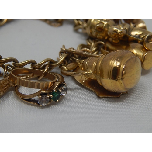 334 - Heavy 9ct Gold Charm Bracelet with 22 Charms: Gross Weight 67.8g