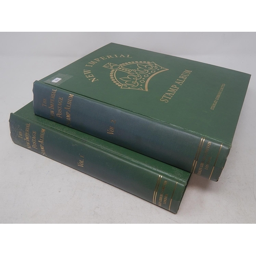20 - A pair of green vintage New Imperial Postage Stamp Albums first one containing a Penny Black, Twopen... 
