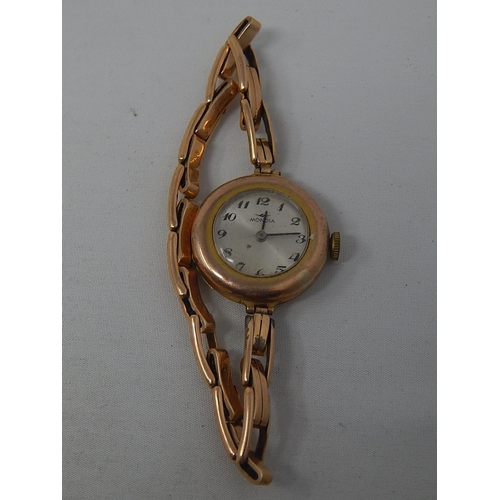 9ct Gold Ladies Wristwatch on 15ct Gold Strap: Gross weight 22.1g