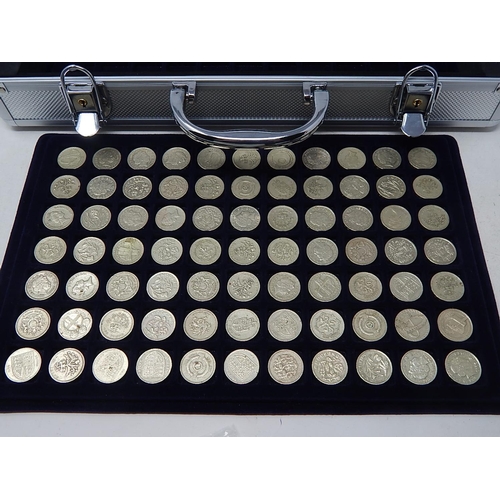 Collectors steel coin case with fitted trays containing a collection of