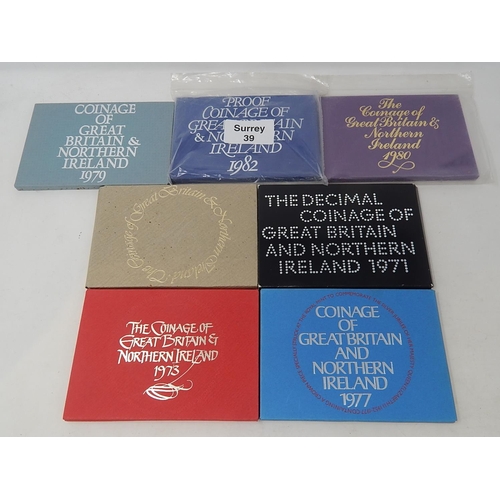 39 - GB Proof Sets 1971, 1973, 1976,1977, 1979, 1980, 1982 all housed in Royal Mint cases, some toned