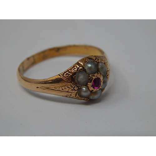 7 - 9ct Yellow Ring Inset with a Central Ruby & Pearl Border: Size N: Gross weight 2.3g