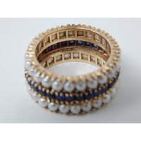 18ct Gold Eternity Ring Set with a Central Band of Sapphires Bordered with Bands of Pearls: Ring Size L: Weight 7.1g