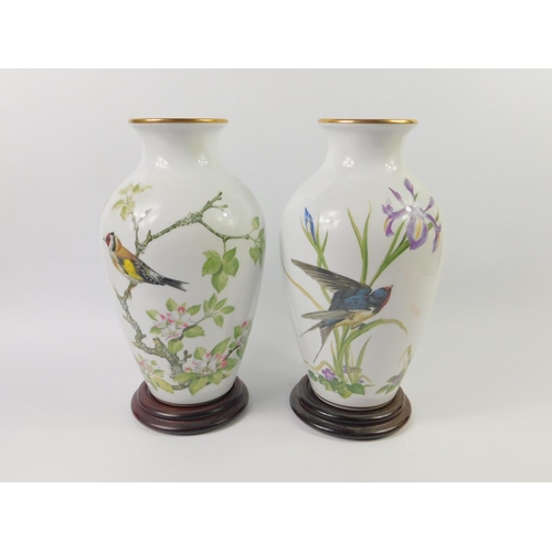 A Pair Of Franklin Mint Porcelain Vases Decorated In The