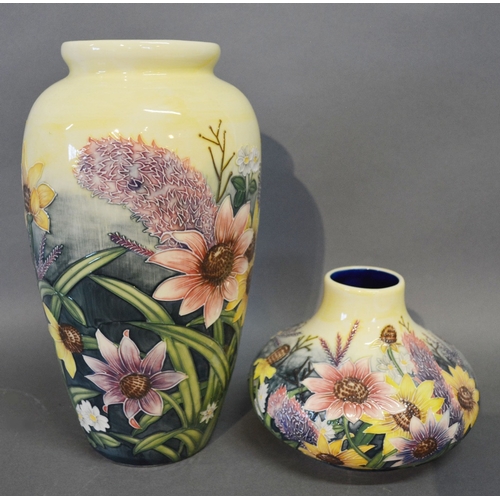 A Moorcroft Style Oviform Vase Tube Lined Together With A Similar