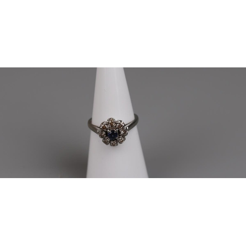 33 - 18ct white gold sapphire and diamond cluster ring - Size K