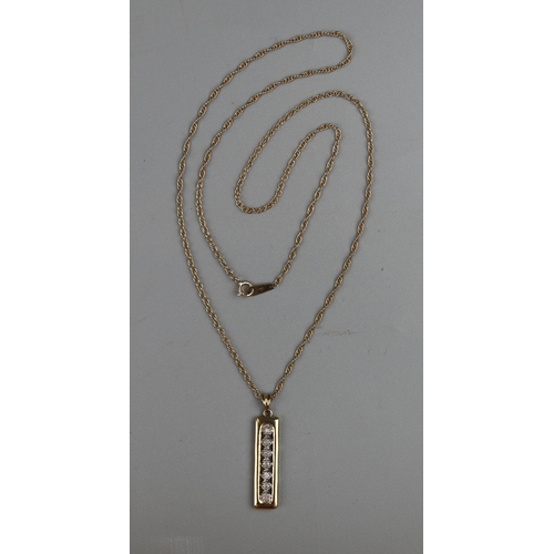 35 - Gold 7 stone diamond pendant on a gold rope chain