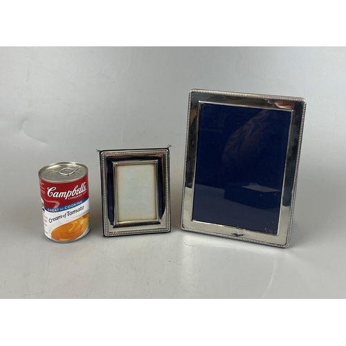 31 - Pair of silver photo frames