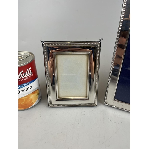 31 - Pair of silver photo frames