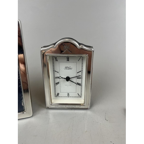 32 - Pair of silver photo frames with silver framed clock