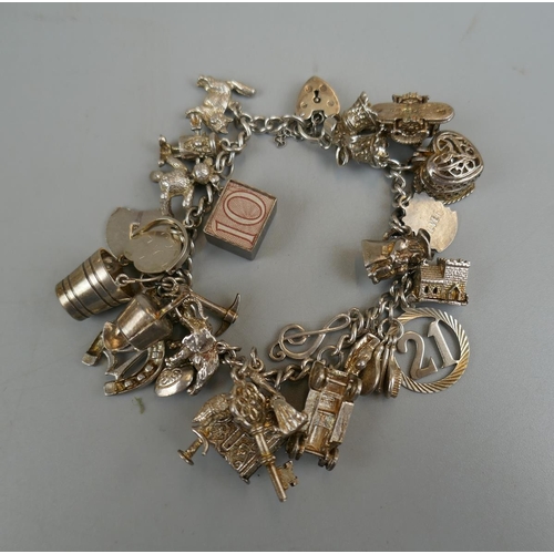 32 - Silver charm bracelet - Approx weight: 71g
