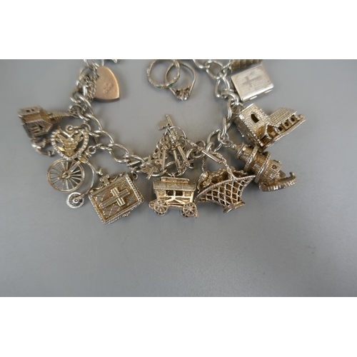 31 - Silver charm bracelet - Approx weight: 73g