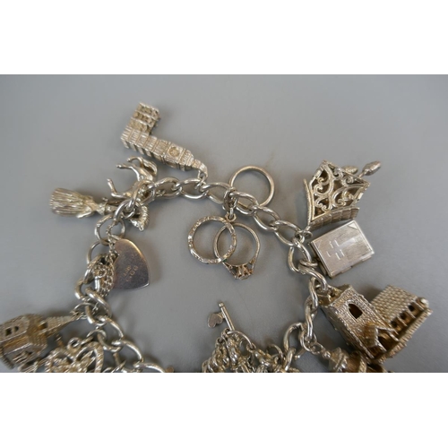 31 - Silver charm bracelet - Approx weight: 73g