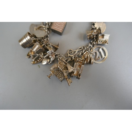 32 - Silver charm bracelet - Approx weight: 71g