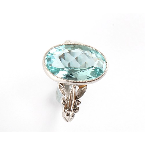 27 - An 18ct white gold aquamarine ring, the oval cut aquamarine weighing an estimated 5.60 carats, in mi... 