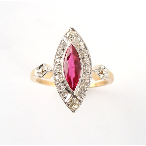 23 - An early 20th century yellow gold ruby & diamond ring, the marquise cut ruby weighing an estimated 0... 