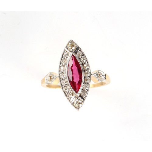23 - An early 20th century yellow gold ruby & diamond ring, the marquise cut ruby weighing an estimated 0... 