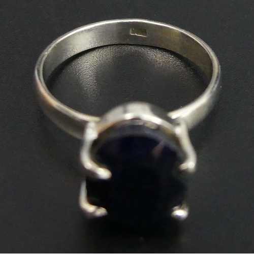 32 - Oval blue sapphire Sterling silver ring, 5.5 grams. Size T, 12.8 mm top. UK Postage £12.