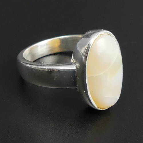 17 - Sterling silver 7 carat opal set ring, size Q 1/2, top 18 mm, band 4.3 grams. 7.4 grams. UK Postage ... 