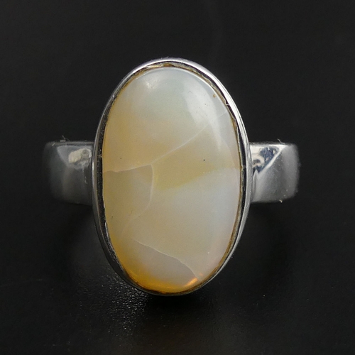 17 - Sterling silver 7 carat opal set ring, size Q 1/2, top 18 mm, band 4.3 grams. 7.4 grams. UK Postage ... 