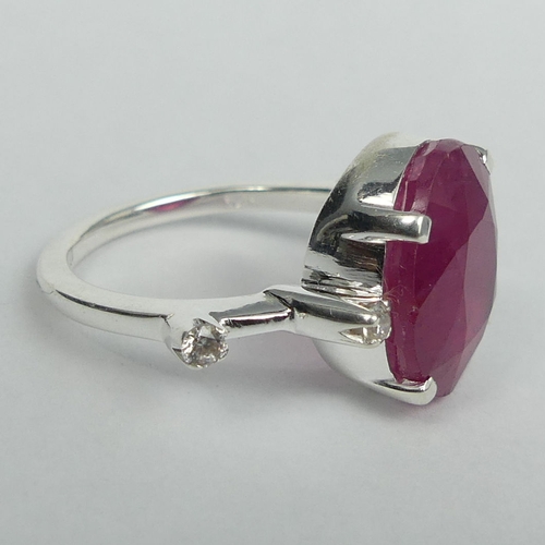47 - Sterling silver 10 carat ruby dress ring, size O 1/2, top 14 mm, 1.7 mm band. 5 grams. UK Postage £1... 