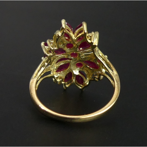 1 - 9 carat gold Ruby & Diamond cluster ring, 4.5 grams, Birmingham 2001. Size R, 23.7 mm wide. UK Posta... 
